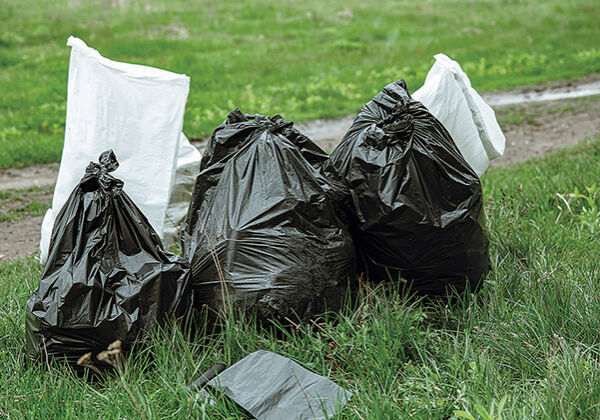 Close up of trash bags filled with trash after cleaning the environment.