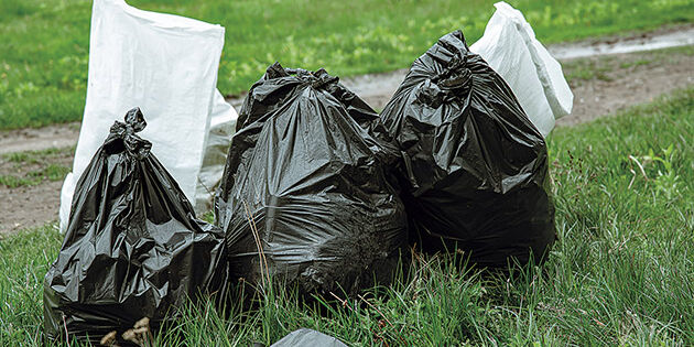 Close up of trash bags filled with trash after cleaning the environment.